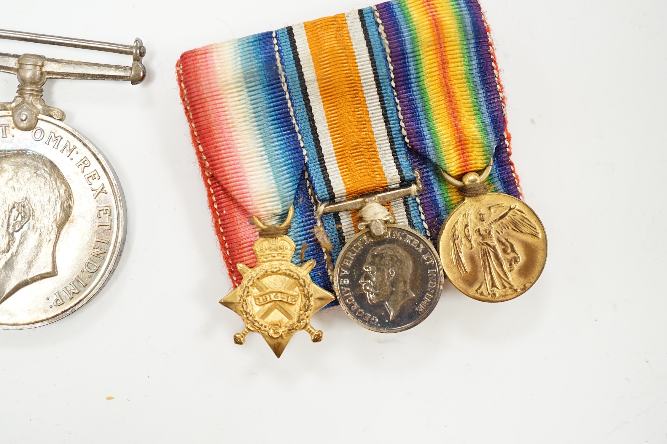 A First World War medal trio awarded to Pte. R.N. Randell, Canadian Forces, together with the miniature set, original card box of issue, the original envelope, paperwork and War Office issued folder. Condition - fair to